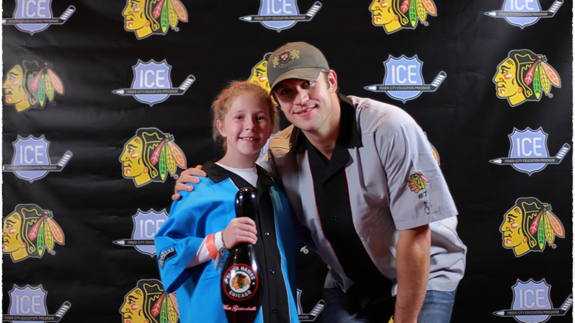 Photo of Chicago Blackhawks Brent Seabrook and young girl holding a bowling pin