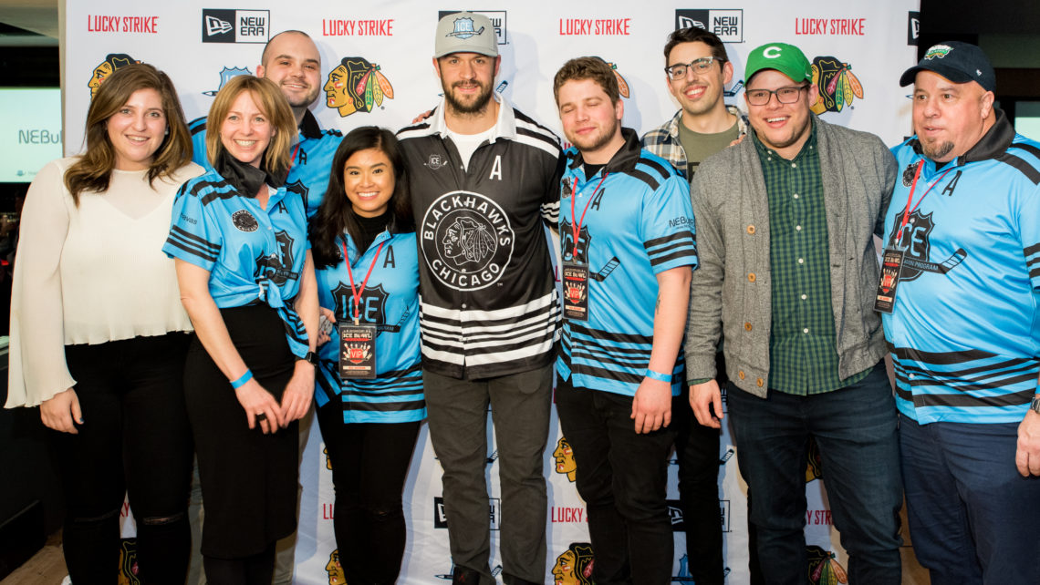 Chicago Blackhawk Brent Seabrook poses with group at fundraiser