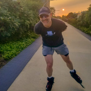 Brad skates down bike path